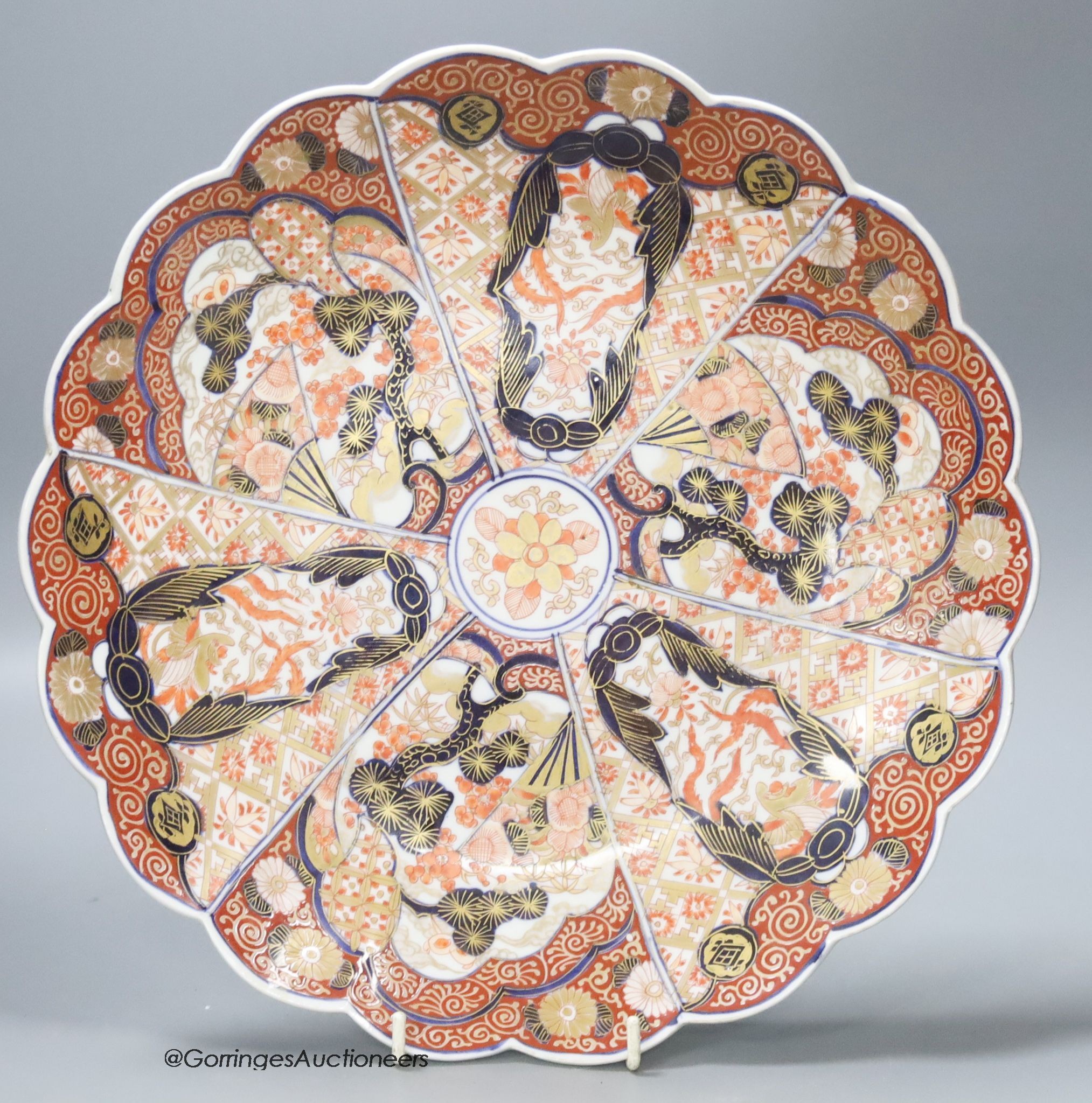 A Chinese famille rose jardiniere, height 29cm, and a Japanese imari dish